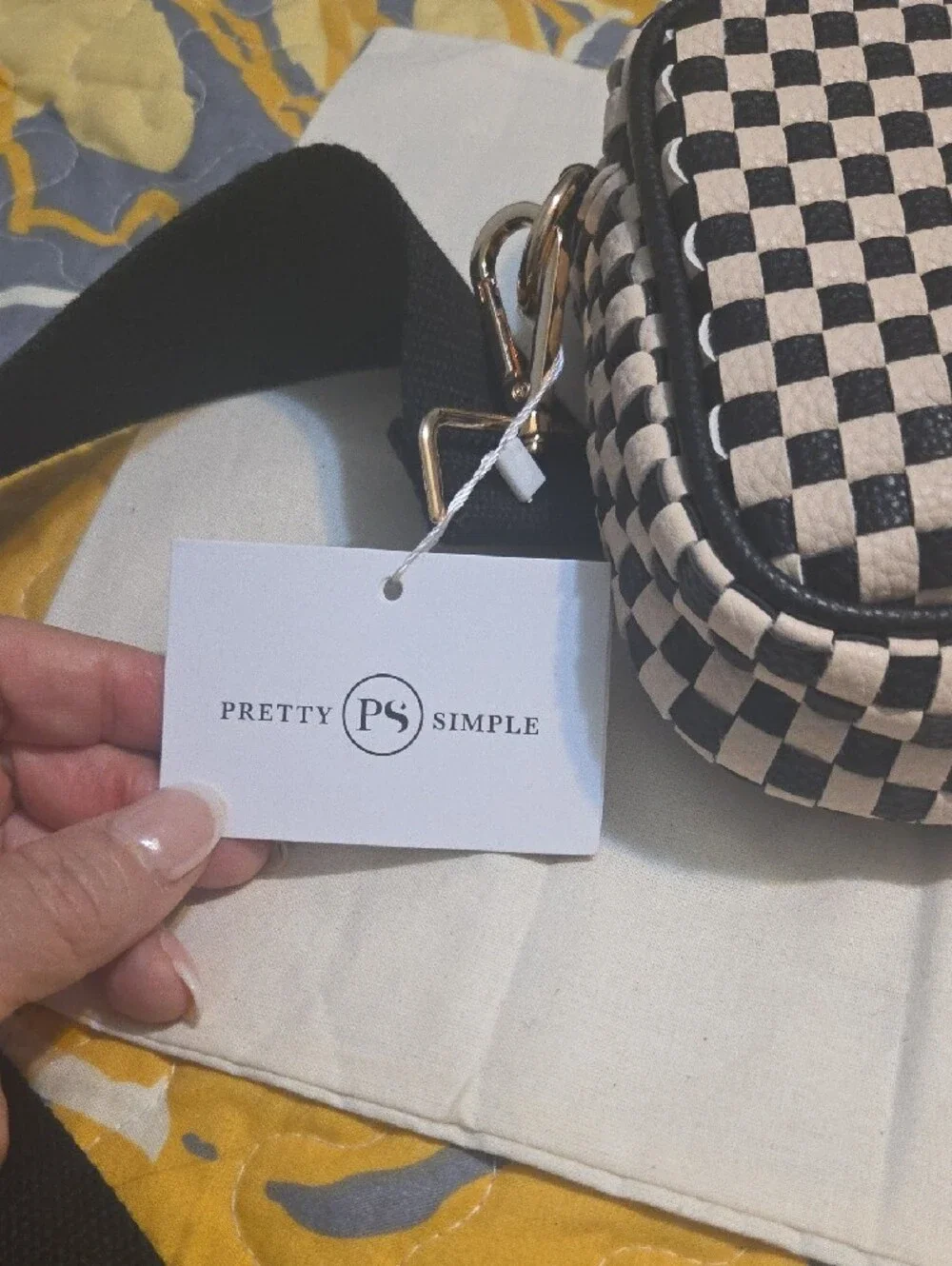 Checkered Black and White Crossbody Bag with Tassel Accent